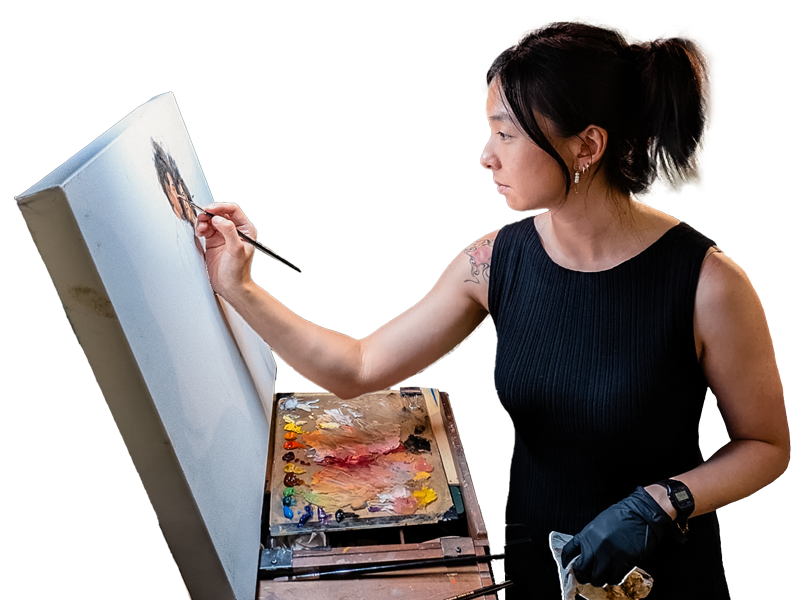 Woman painting on an easel with a white background
